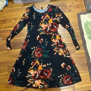 A line long sleeve floral dress. Size medium.